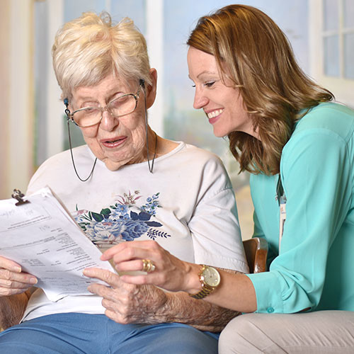 Doctor helping patient fill out paperwork